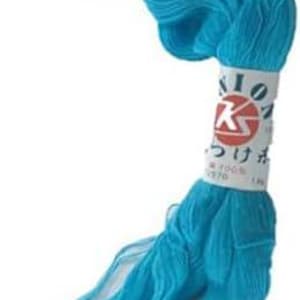 May include: A skein of turquoise blue silk thread with a label that reads "Sashiko" in Japanese and "100% Silk" in English.