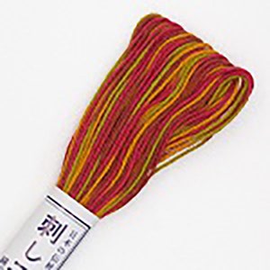 May include: A skein of embroidery floss in red, yellow, and green. The floss is wrapped around a white label with Japanese text that reads "刺しゅう糸" which translates to "embroidery thread".
