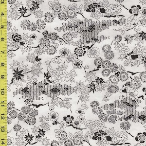 May include: White fabric with a repeating pattern of black floral and geometric designs. The pattern includes various flower types, leaves, and stylized geometric shapes. The fabric is measured in inches.
