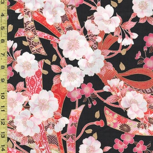 May include: Black fabric with a floral pattern featuring white and pink cherry blossoms, red ribbons, and gold accents. The design includes Japanese-inspired fan and wave motifs. The fabric is measured in inches.