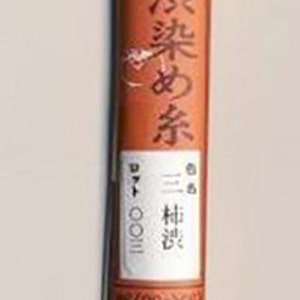 May include: A spool of brown thread labeled "柿渋染め糸" (Kakishibu-zome ito) in Japanese, meaning "persimmon-dyed thread". The label also indicates the thread is 100% cotton and 20 meters long. The spool is labeled with the number "#3".