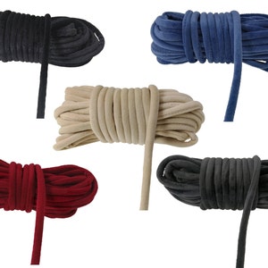May include: Five spools of soft, velvety cord in different colours: black, blue, beige, red, and grey. The cords are all approximately 1.2 cm thick and are ideal for crafting projects.