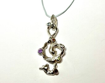 Treble clef in 925 silver set with fine stones