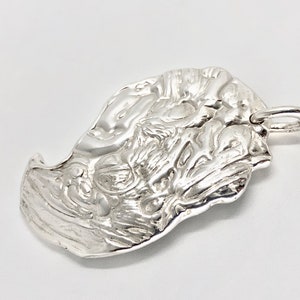 Silver claw pendant. image 5