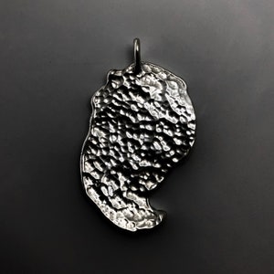 Silver claw pendant. image 3