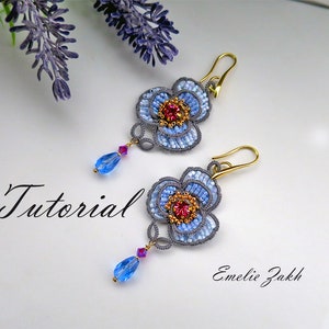 May include: A pair of blue and gold beaded flower earrings with a red crystal center. The earrings are hanging from gold hooks and have a blue crystal dangle. The image includes the text "Tutorial" and "Emelie Zakk".