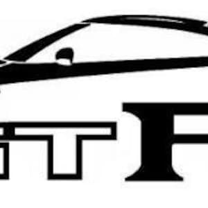 May include: A black and white graphic decal featuring the stylized silhouette outline of a sports car positioned above the bold, capital letters GTR. The design uses clean lines to define the vehicle's roofline, hood, and rear spoiler.