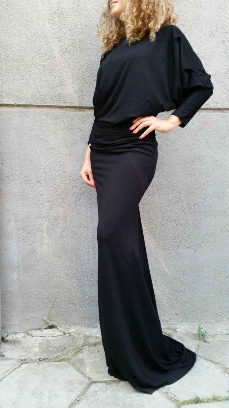 black dress with long sleeves and open back
