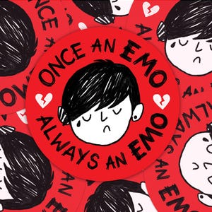 May include: A circular red sticker featuring a black and white illustration of a person with short dark hair and a sad expression. The text "ONCE AN EMO ALWAYS AN EMO" is printed in black around the illustration, accompanied by two small white broken heart icons.