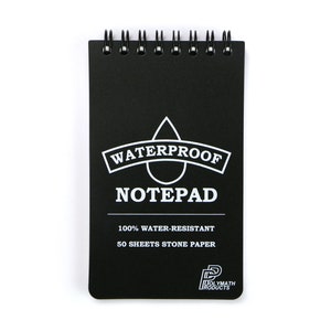 May include: Black waterproof notepad with a white water drop and the text "WATERPROOF NOTEPAD" and "100% WATER-RESISTANT 50 SHEETS STONE PAPER" and the Polymath Products logo.