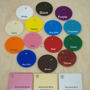 May include: Assortment of 14 round acrylic mirror samples in various colors, including black, white, purple, yellow, turquoise, ivory, blue 2648, pink, green, orange, red, tortoise, blue 2051, and brown.  Also included are three rectangular acrylic mirror samples in pink, gold, and clear.