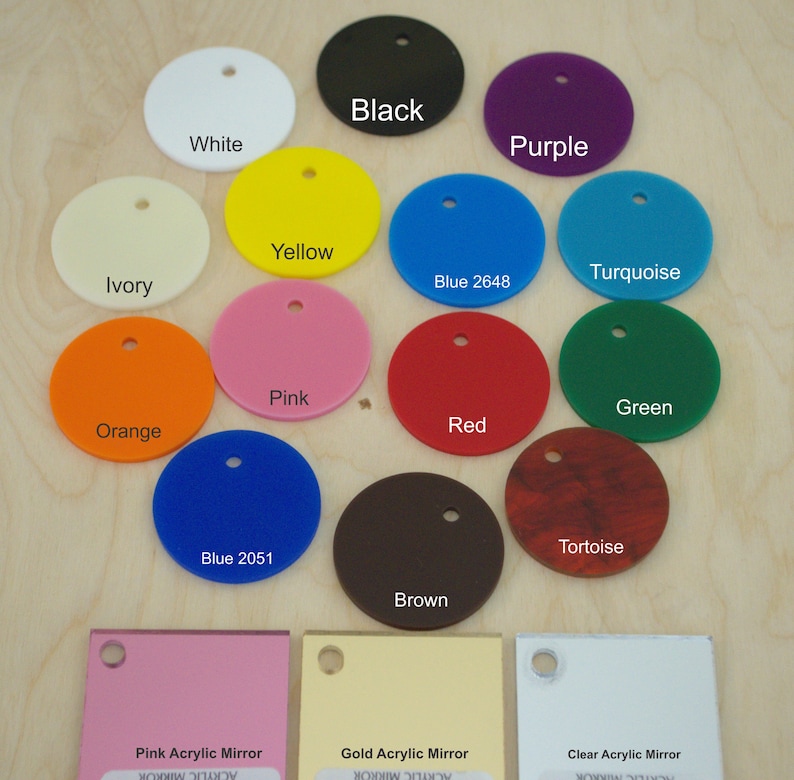 May include: Assortment of 14 round acrylic mirror samples in various colors, including black, white, purple, yellow, turquoise, ivory, blue 2648, pink, green, orange, red, tortoise, blue 2051, and brown.  Also included are three rectangular acrylic mirror samples in pink, gold, and clear.