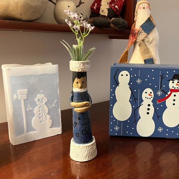 Bud base, Vases with Attitude: Emma loves putting on her blue coat and going for a walk in the snow!