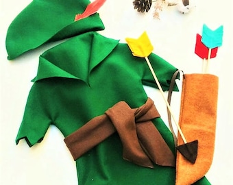 May include: A green felt costume with a brown belt, a green felt hat with a red feather, and a brown felt quiver with three felt arrows. The costume is for a child.