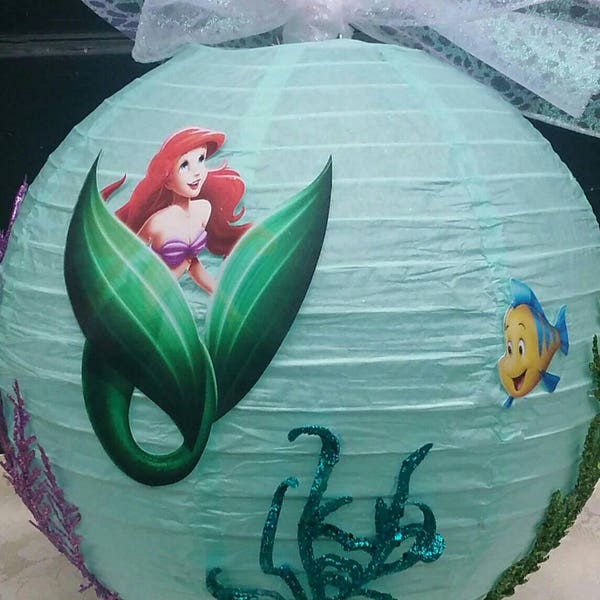 The Little Mermaid centerpiece with Ariel Sebastian and Flounder and sparkling sea plants and colorful seafloor foot for under the sea party