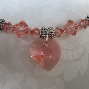 Swarovski Rose Peach heart necklace and earring set with radiant rosy elegance
