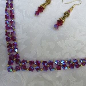 Swarovski Siam AB2X V shaped necklace, earrings with rich, red radiance