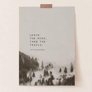 May include: A black and white photo of a misty forest with the quote "Leave the road, take the trails. -Pythagoras" printed on a light gray background.