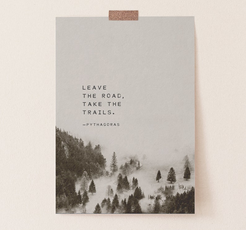 May include: A black and white photo of a misty forest with the quote "Leave the road, take the trails. -Pythagoras" printed on a light gray background.