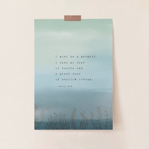 May include: A blue and green watercolour background with a quote by Anais Nin that reads: "I must be a mermaid, I have no fear of depths and a great fear of shallow living."