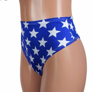 May include: High-waisted, blue and white star-print underwear with a cheeky cut. The underwear is made of a stretchy, comfortable fabric.