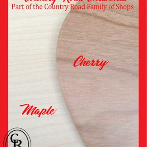 May include: Close-up of two wood samples, one maple and one cherry. The samples are part of the Country Road Christmas Family of Shops.