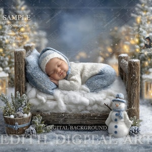 Puede incluir: Un bebé dormido con un conjunto y gorro blanco y azul, descansando en una pequeña cama de madera con una almohada azul. La escena está ambientada en un país de las maravillas invernal con un muñeco de nieve y árboles cubiertos de nieve.