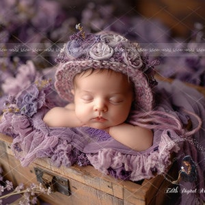 May include: A sleeping baby wearing a purple crocheted hat with flower embellishments, lying in a purple lace-trimmed basket.