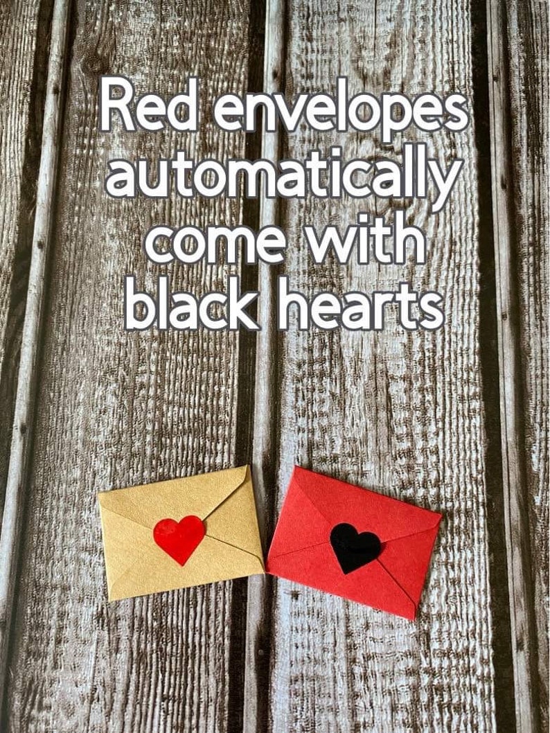 May include: Two envelopes, one red and one brown, with hearts on the front. The red envelope has a black heart, and the brown envelope has a red heart. The text "Red envelopes automatically come with black hearts" is written on a wooden background.