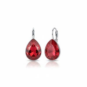 May include: A pair of teardrop-shaped earrings with a vibrant red gemstone set in a silver-colored metal. The earrings have a lever-back closure and reflect light, showcasing their faceted design. The jewelry is displayed on a white background.