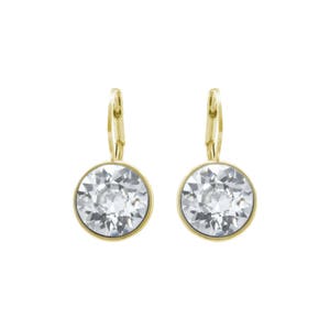 May include: A pair of gold-tone earrings with clear crystal stones. The earrings have a simple, elegant design.
