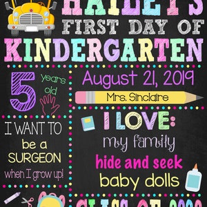 May include: A chalkboard-style sign for Hailey's first day of kindergarten, dated August 21, 2019. It features a yellow school bus, a pencil, a backpack, crayons, and text detailing the child's age, teacher, interests, and future career goals.