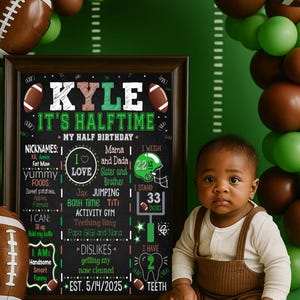 May include: A baby sits in front of a chalkboard sign that reads "Kyle, It's Halftime." The sign includes the baby's nicknames, favorite foods, and height of 33 inches. Football-themed balloons and decorations surround the baby.