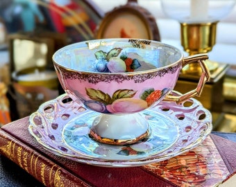 Vintage Barbie Pink Unmarked Footed Pearlescent Lusterware Teacup And Saucer Set With Vivid Fruit, Heavy Gold Details And Geometric Designs