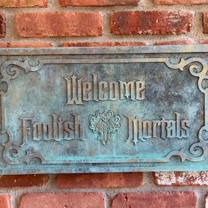 Disney The Haunted Mansion &#39;Welcome Foolish Mortals&#39; carved sign Bronze paint with Patina aging