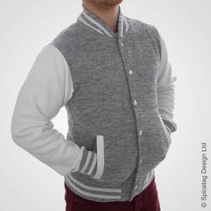 May include: A gray and white varsity jacket with a button closure. The jacket has white sleeves and a gray body with white stripes on the collar, cuffs, and pockets.