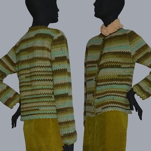 May include: A striped crocheted cardigan in shades of green, brown, and blue. The cardigan has a button closure and long sleeves.