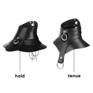 May include: Two black leather-like collars featuring layered designs and silver-toned metal rings. The left collar is labeled hold and features a flared, tiered structure with laces. The right collar is labeled tenue and includes a vertical strap.