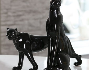Set of 2 black ceramic panthers. Models sitting and standing, dimensions between 13 to 15'7 inches. For collection or decoration
