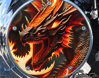 May include: A close-up of a motorcycle engine cover with a fiery orange dragon design. The dragon's eyes are glowing red and its mouth is open in a roar. The cover is made of metal and has a chrome finish.