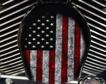 May include: A black motorcycle air cleaner cover with a distressed American flag design. The flag is red, white and blue with white stars on a blue field.