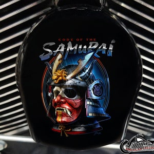 May include: Black motorcycle component featuring a samurai skull graphic in a helmet. The text "CODE OF THE SAMURAI" is above the image. The samurai's face is red and gold, with a gold dragon on the helmet.