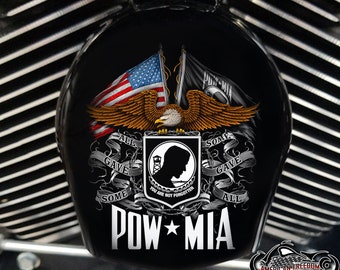 May include: A black motorcycle fuel tank cover with a POW MIA design. The design features an American flag, a bald eagle, and a POW MIA emblem with the text "You are not forgotten". The text "All gave some, some gave all" is also included.