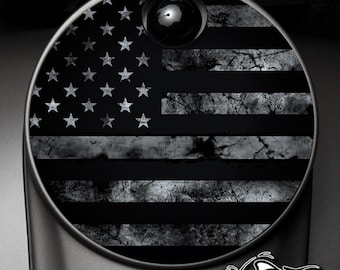 May include: A black and white distressed American flag design on a round sticker. The sticker is perfect for adding a patriotic touch to any surface.