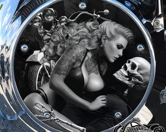 May include: Black and white illustration of a woman with a skull on a motorcycle. The woman is wearing a leather bra and has tattoos on her arms. The skull is wearing a bandana. The image is in a circular frame with the words "American Freedom" at the bottom.