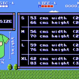 K&ouml;nnte beinhalten: Eine blaue und gr&uuml;ne pixelartige Hemdgr&ouml;&szlig;entabelle mit Ma&szlig;en in Zentimetern und Zoll. Die Tabelle zeigt die Breite und H&ouml;he der verschiedenen Gr&ouml;&szlig;en: S, M, L und XL. Die Tabelle stammt aus einem Videospiel.