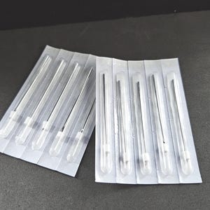 May include: A package of 10 sterile tattoo needles, individually packaged in clear plastic.