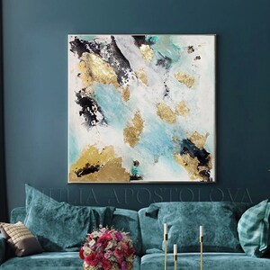May include: Abstract painting with gold and teal accents on a white canvas. The painting is hanging on a teal wall above a teal velvet sofa with gold accents.