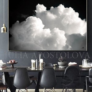 Large black and white painting, hanging in a modern dining room.