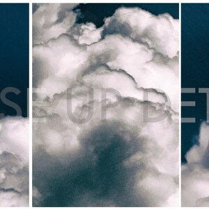 May include: A close-up of fluffy white clouds against a deep blue sky. The clouds are arranged in a layered pattern, creating a sense of depth and texture.